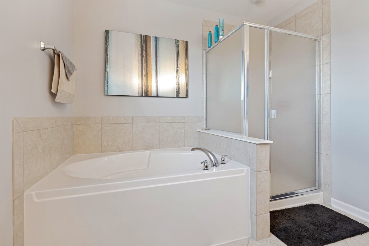3001 Wagon Road Elgin, IL 60124 - Photo 20 of 39 a white bath tub sitting next to a window