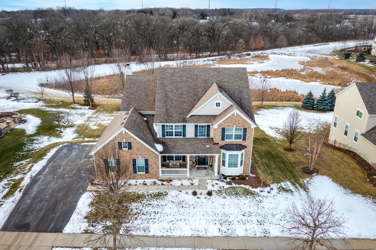 3001 Wagon Road Elgin, IL 60124 - Photo 2 of 39 a front view of a house with a yard