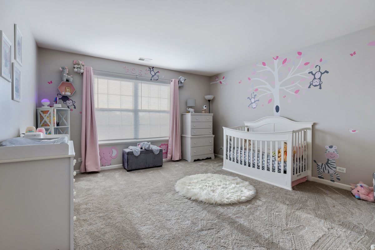 3001 Wagon Road Elgin, IL 60124 - Photo 22 of 39 a bedroom with furniture and a window