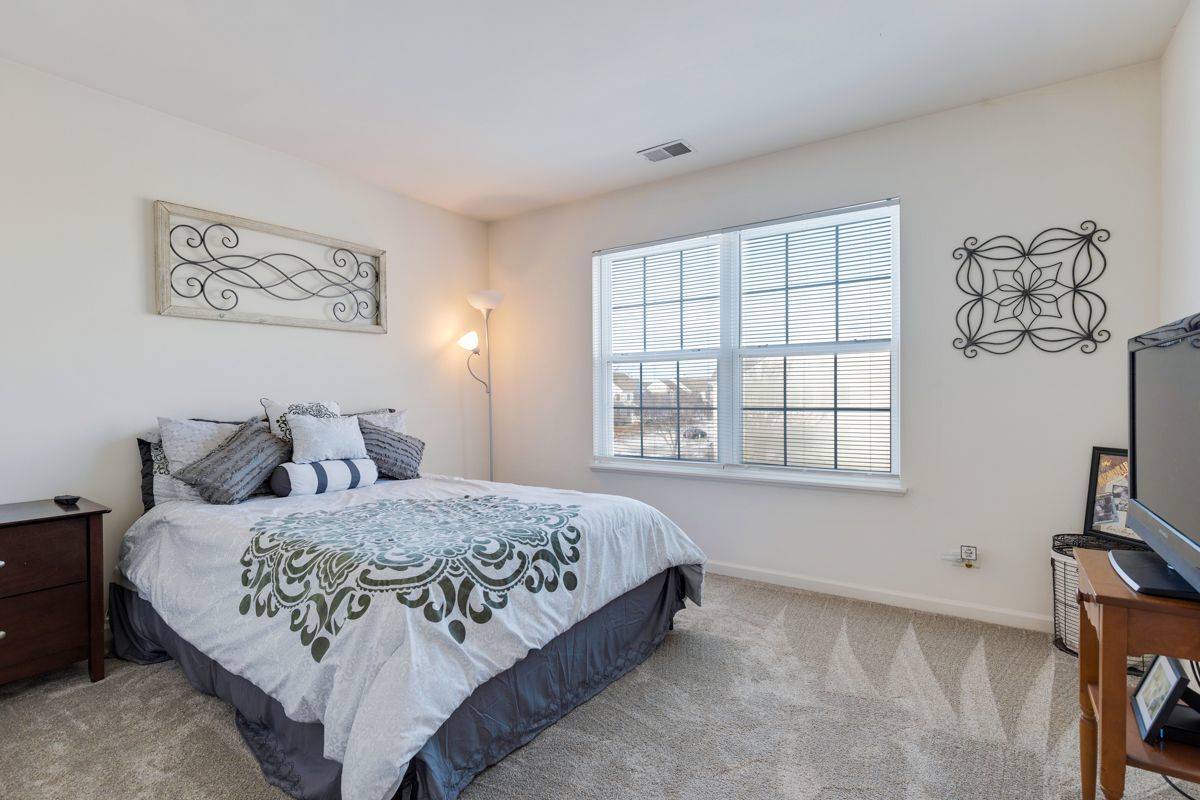 3001 Wagon Road Elgin, IL 60124 - Photo 23 of 39 a bedroom with a bed and a window