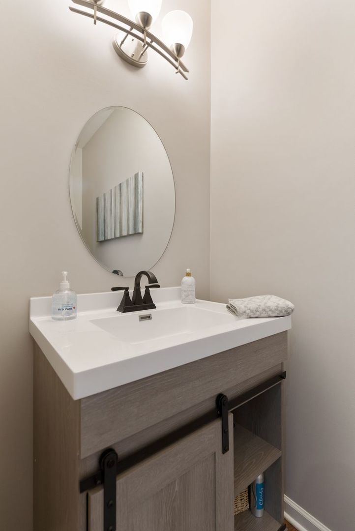 3001 Wagon Road Elgin, IL 60124 - Photo 36 of 39 a bathroom with a sink and a mirror