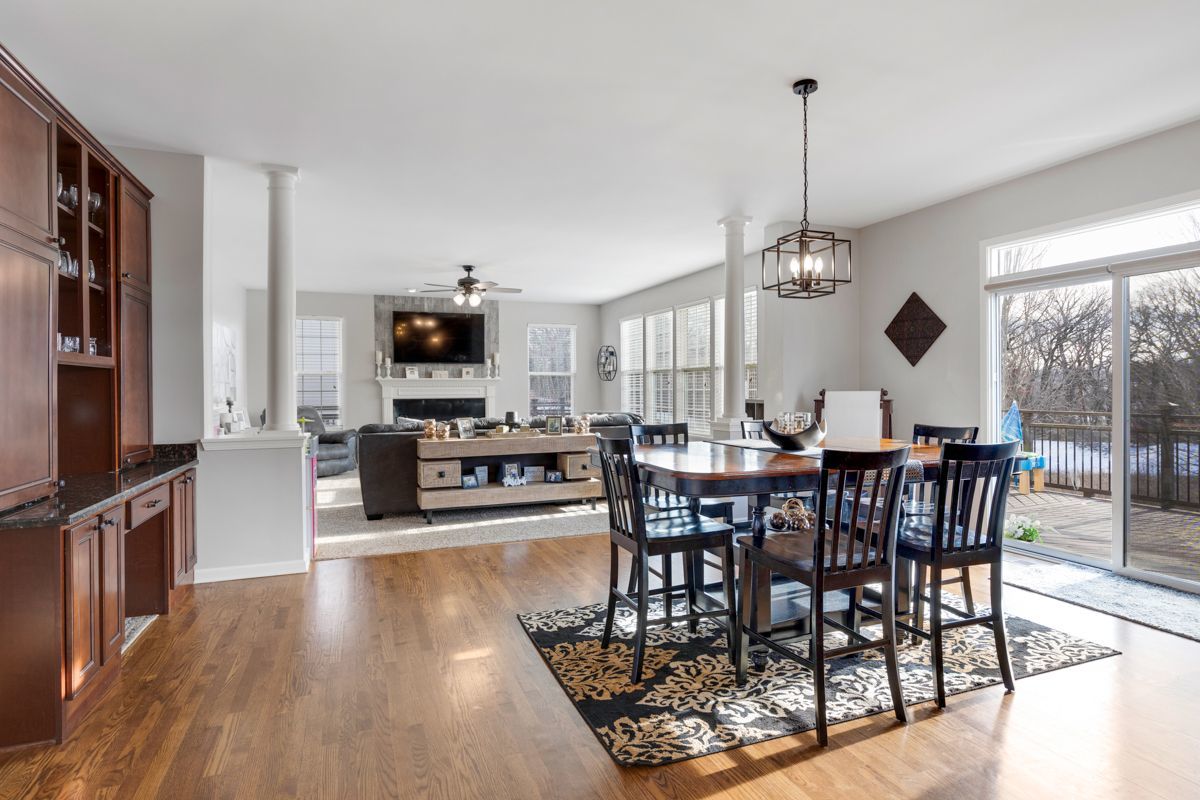 3001 Wagon Road Elgin, IL 60124 - Photo 9 of 39 a view of a dining room and livingroom with furniture wooden floor a chandelier