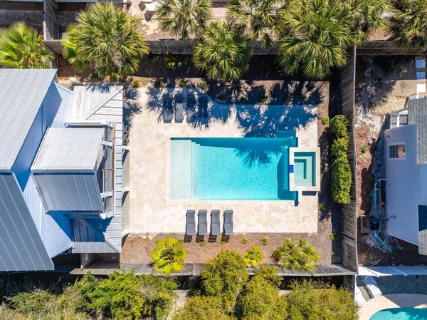 a kitchen with stainless steel appliances granite countertop a sink stove cabinets and a window