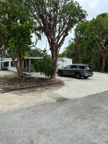 a view of street with parked cars