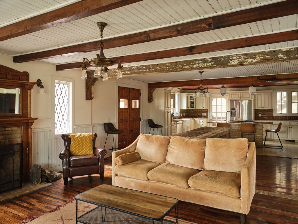 6415 Pinewood Road Nunnelly, TN 37137 - Photo 35 of 83 a living room with furniture and a fireplace