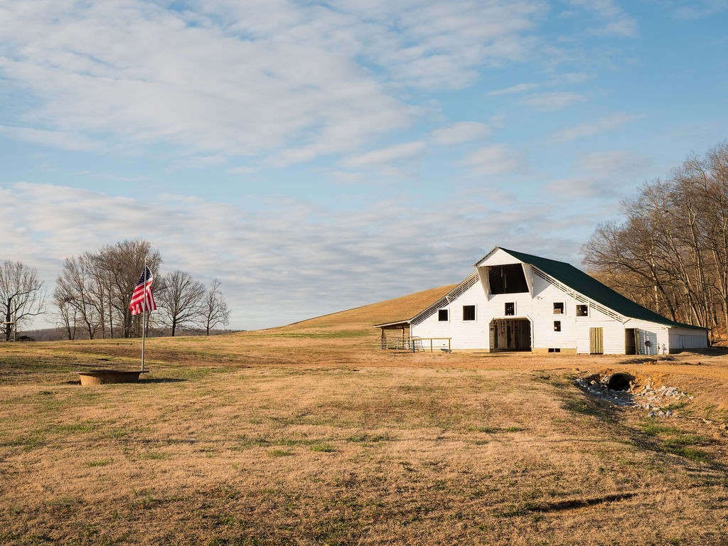 6415 Pinewood Road Nunnelly, TN 37137 - Photo 49 of 83 a view of a white house with a yard