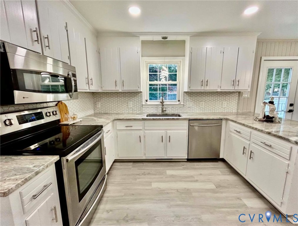7110 Manning Road Chesterfield, VA 23832 - Photo 18 of 50 White cabinetry with brushed nickel hardware, stai