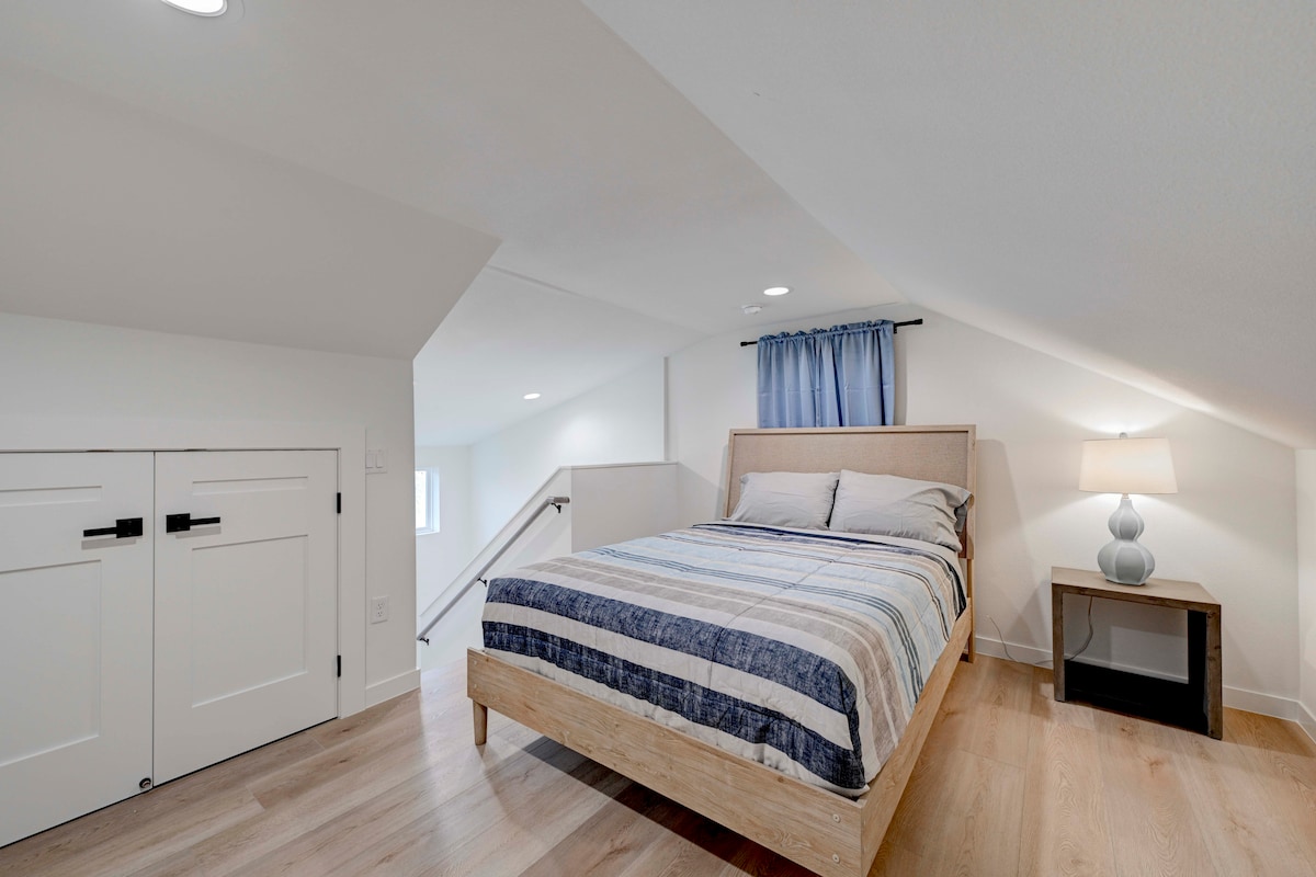 2220 Yellow Jacket Lane, Unit 1 Austin, TX 78741 - Photo 27 of 35 A cozy bedroom loft with bright recessed lighting and light-toned hardwood flooring throughout.