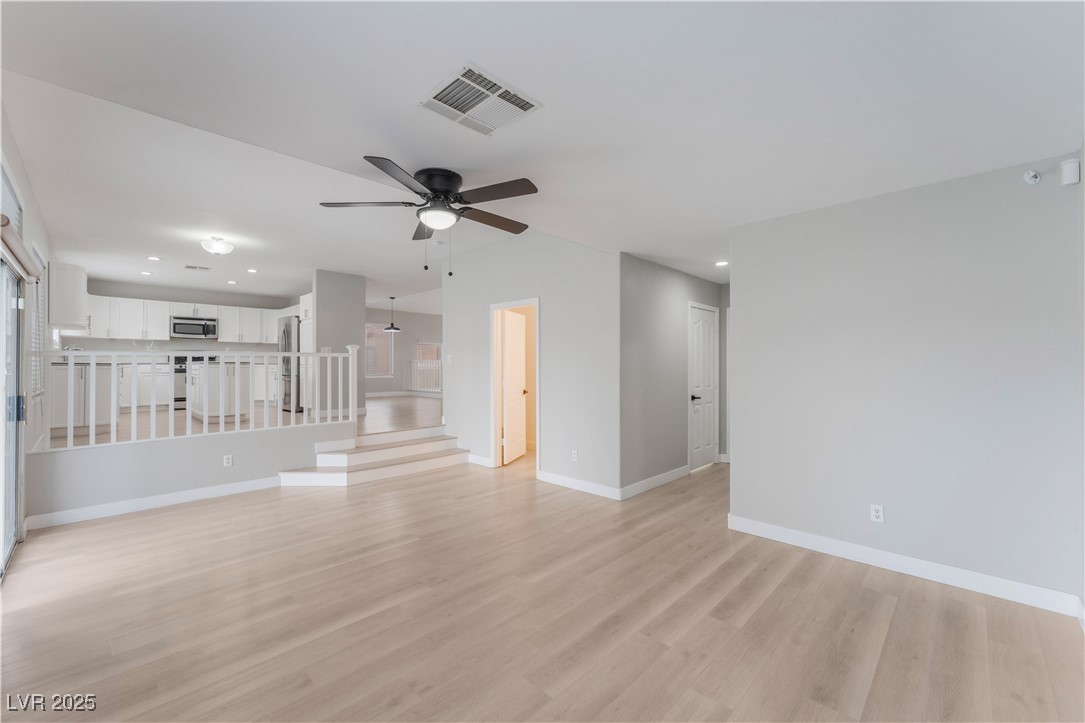 3695 Funston Way Las Vegas, NV 89129 - Photo 17 of 43 Unfurnished living room featuring recessed lighting, light wood-type flooring, and a ceiling fan