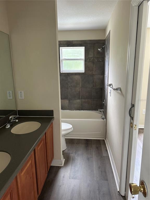 20474 Needletree Drive, Unit 20474 Tampa, FL 33647 - Photo 14 of 25 a bathroom with a granite countertop sink toilet and shower