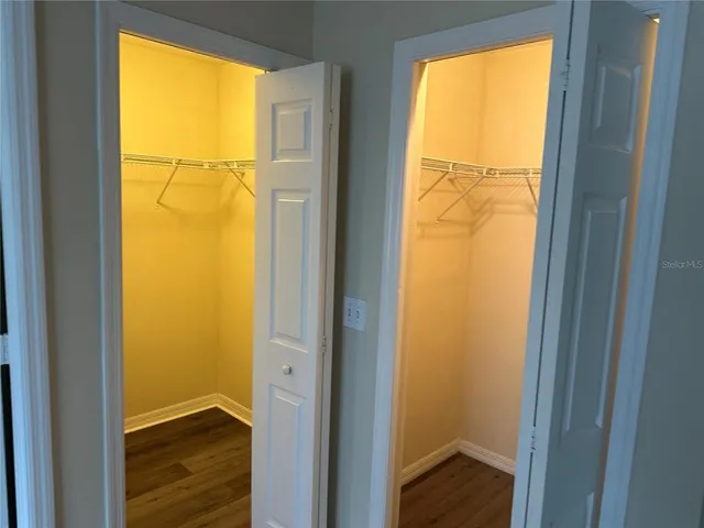 a view of an empty room and a window