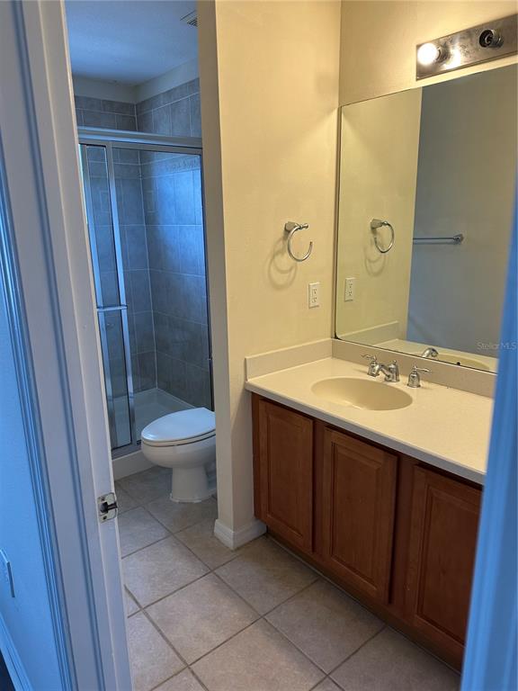 20474 Needletree Drive, Unit 20474 Tampa, FL 33647 - Photo 18 of 25 a bathroom with a double vanity sink toilet and shower