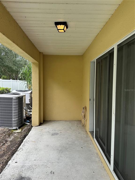 20474 Needletree Drive, Unit 20474 Tampa, FL 33647 - Photo 21 of 25 a view of an empty room with a fireplace and a window