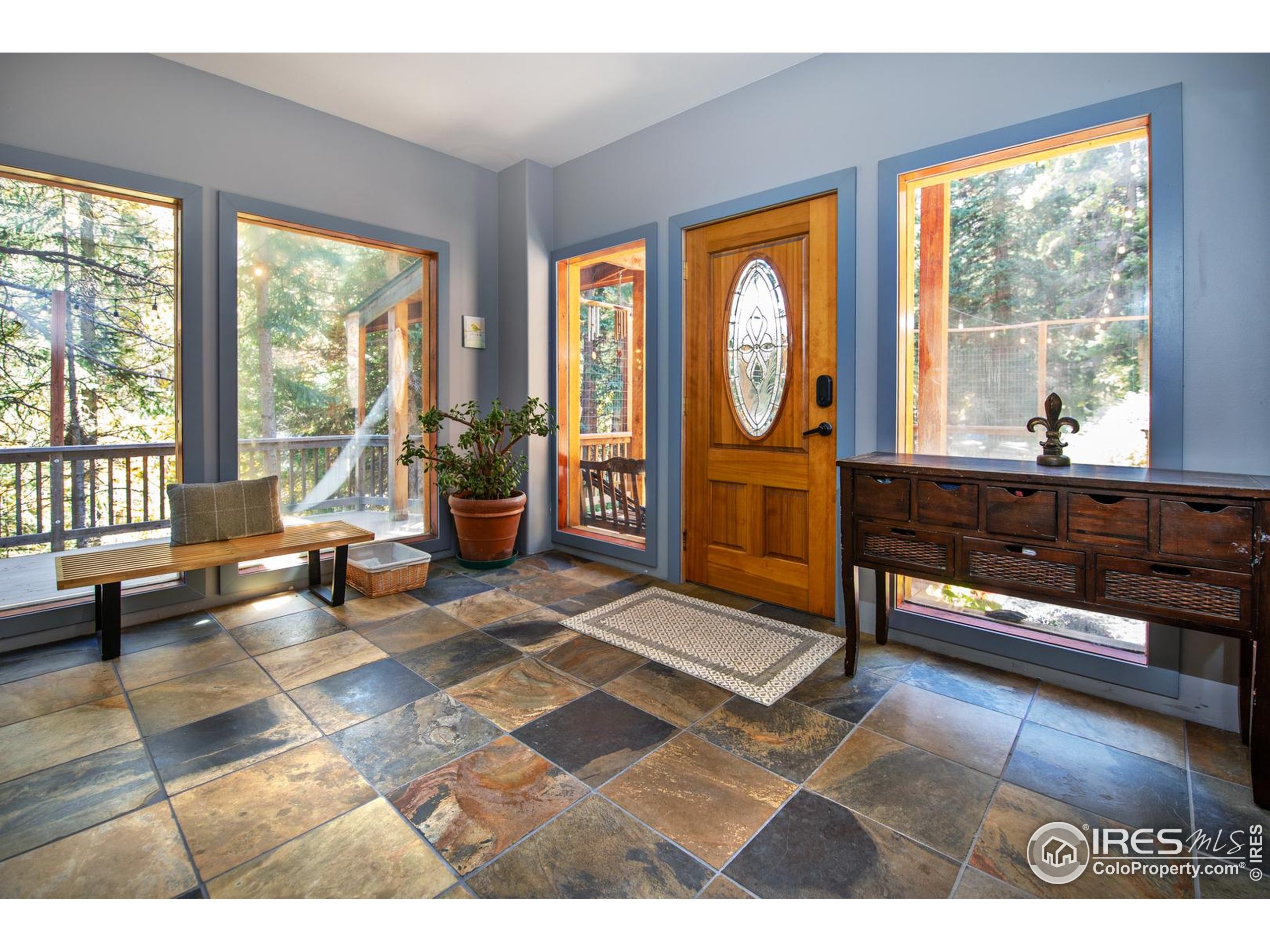 3727 Gamble Gulch Road Black Hawk, CO 80422 - Photo 9 of 30 a living room with furniture and a large window