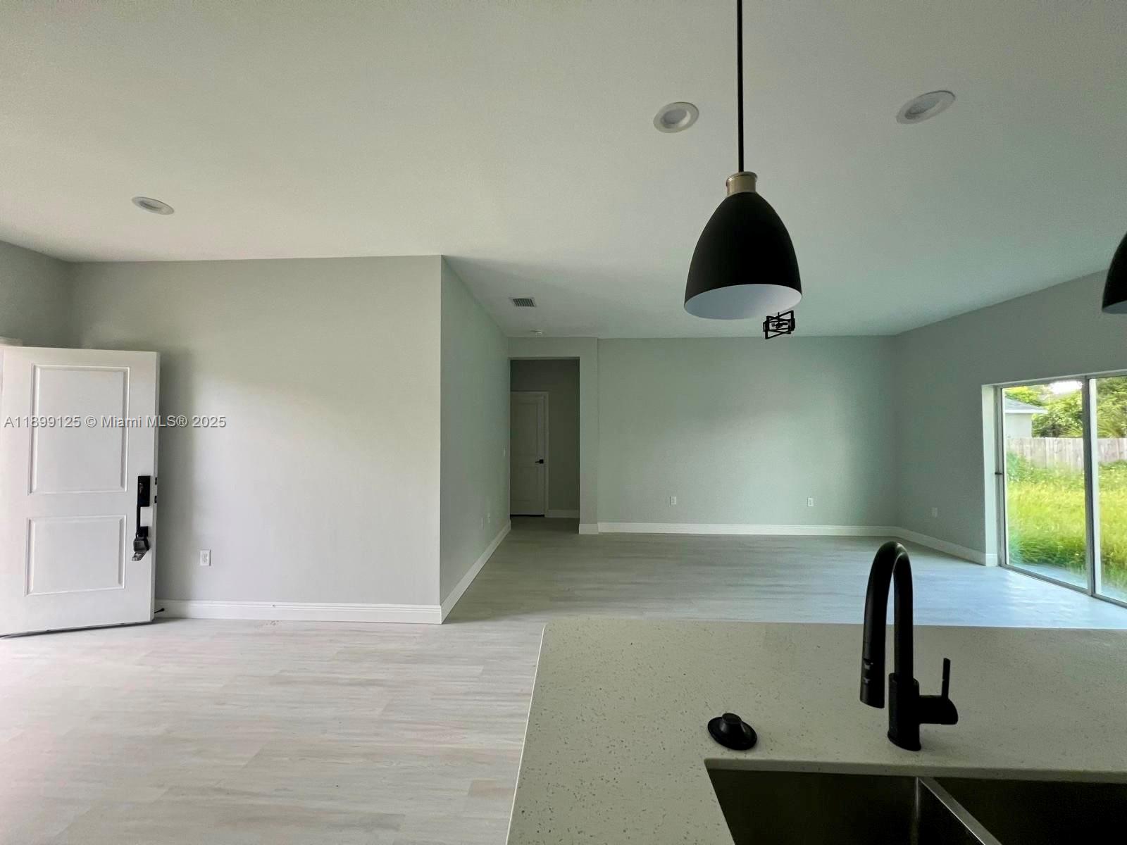 21068 Exmore Avenue, Unit 21068 Port Charlotte, FL 33952 - Photo 3 of 9 a view of counter space with furniture