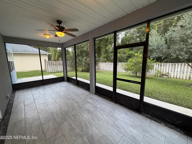 a view of an empty room with a large window
