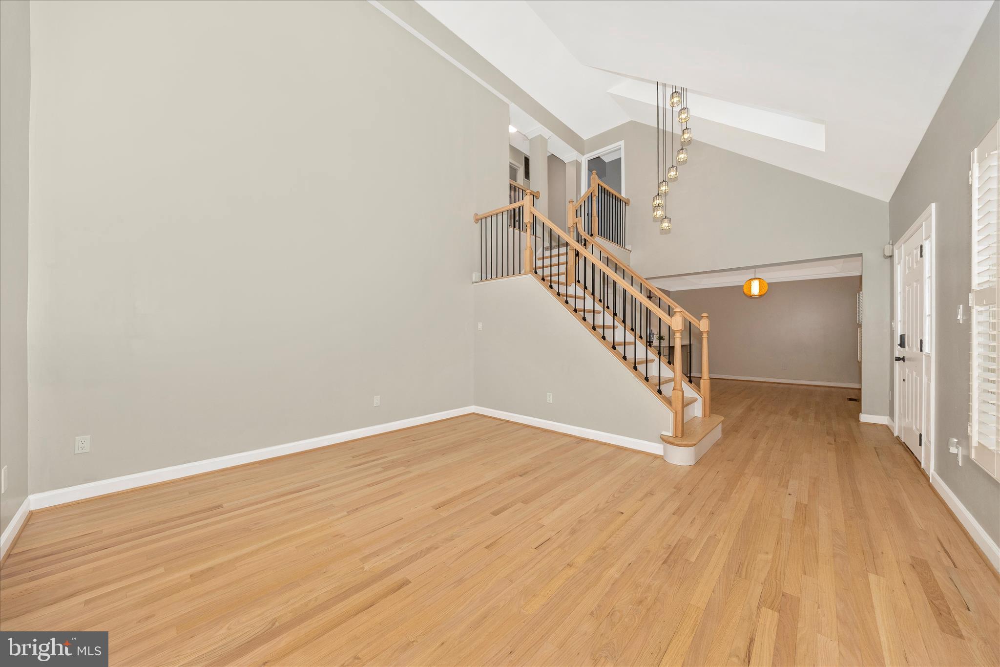 2478-5 Five Shillings Road Frederick, MD 21701 - Photo 11 of 77 a view of a hallway with wooden floor and staircase