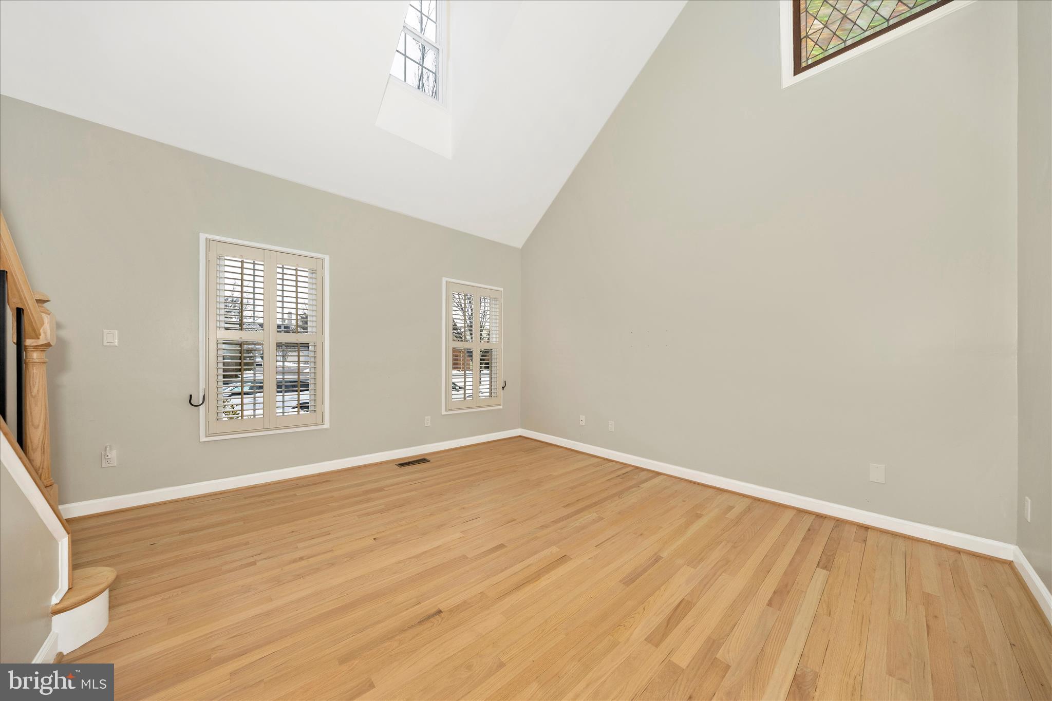 2478-5 Five Shillings Road Frederick, MD 21701 - Photo 13 of 77 a view of an empty room with wooden floor and a window