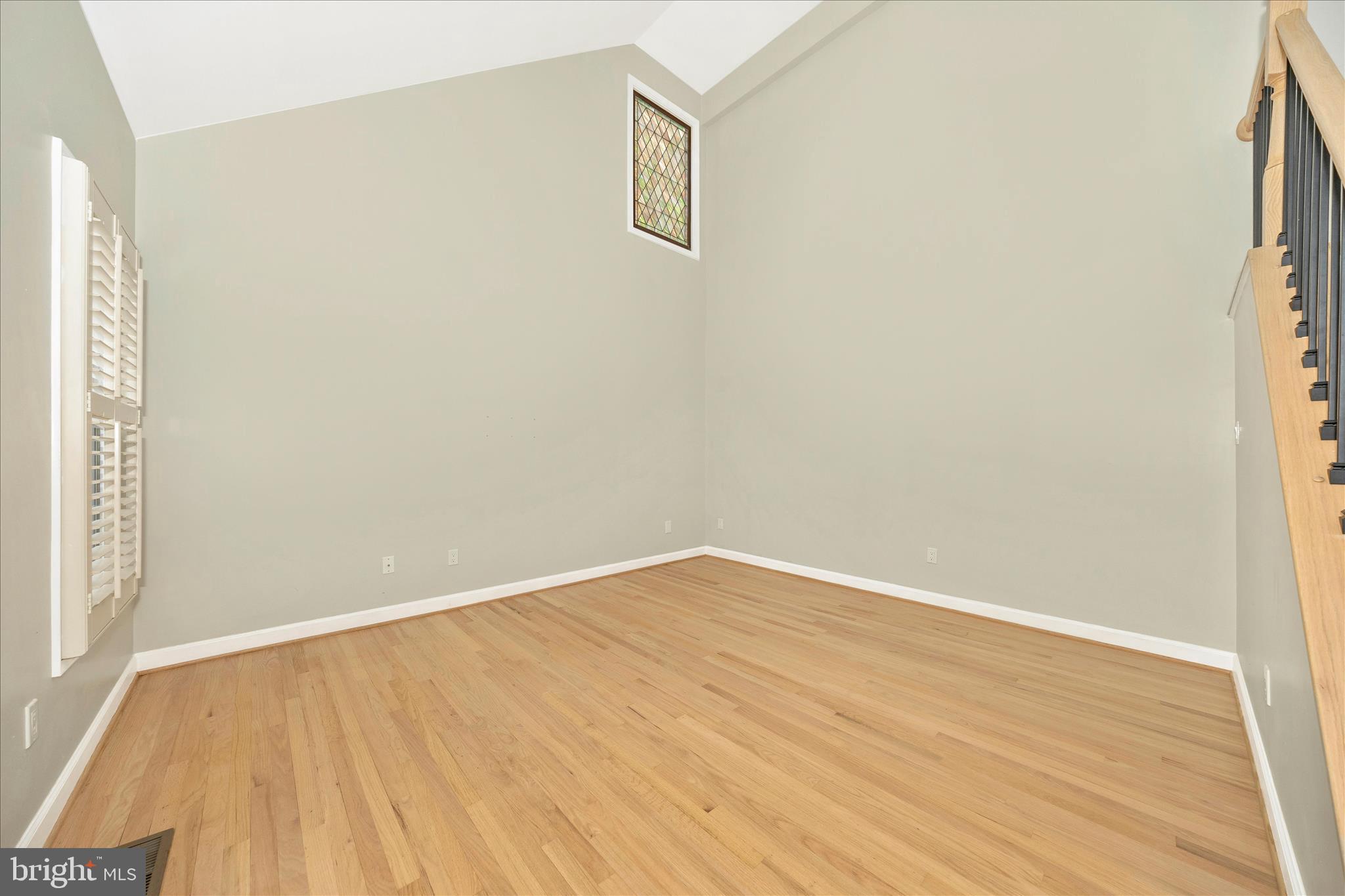 2478-5 Five Shillings Road Frederick, MD 21701 - Photo 14 of 77 a view of an empty room with wooden floor and a window