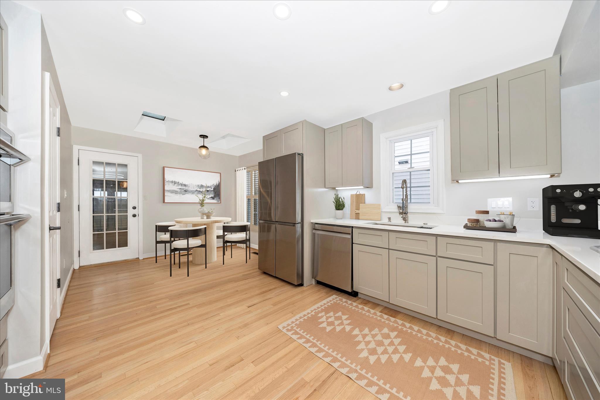 2478-5 Five Shillings Road Frederick, MD 21701 - Photo 19 of 77 a kitchen with granite countertop cabinets stainless steel appliances a sink and a dining table view
