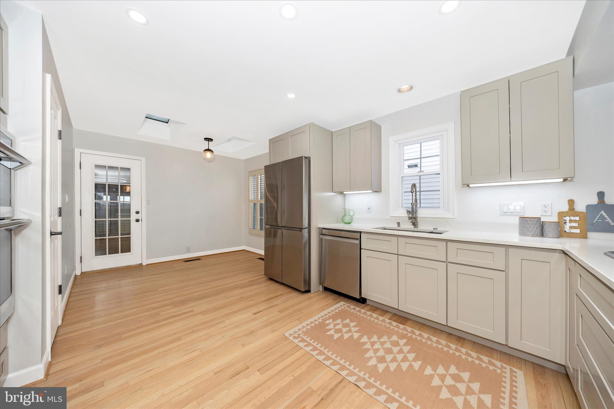 2478-5 Five Shillings Road Frederick, MD 21701 - Photo 20 of 77 a kitchen with granite countertop a refrigerator sink and cabinets