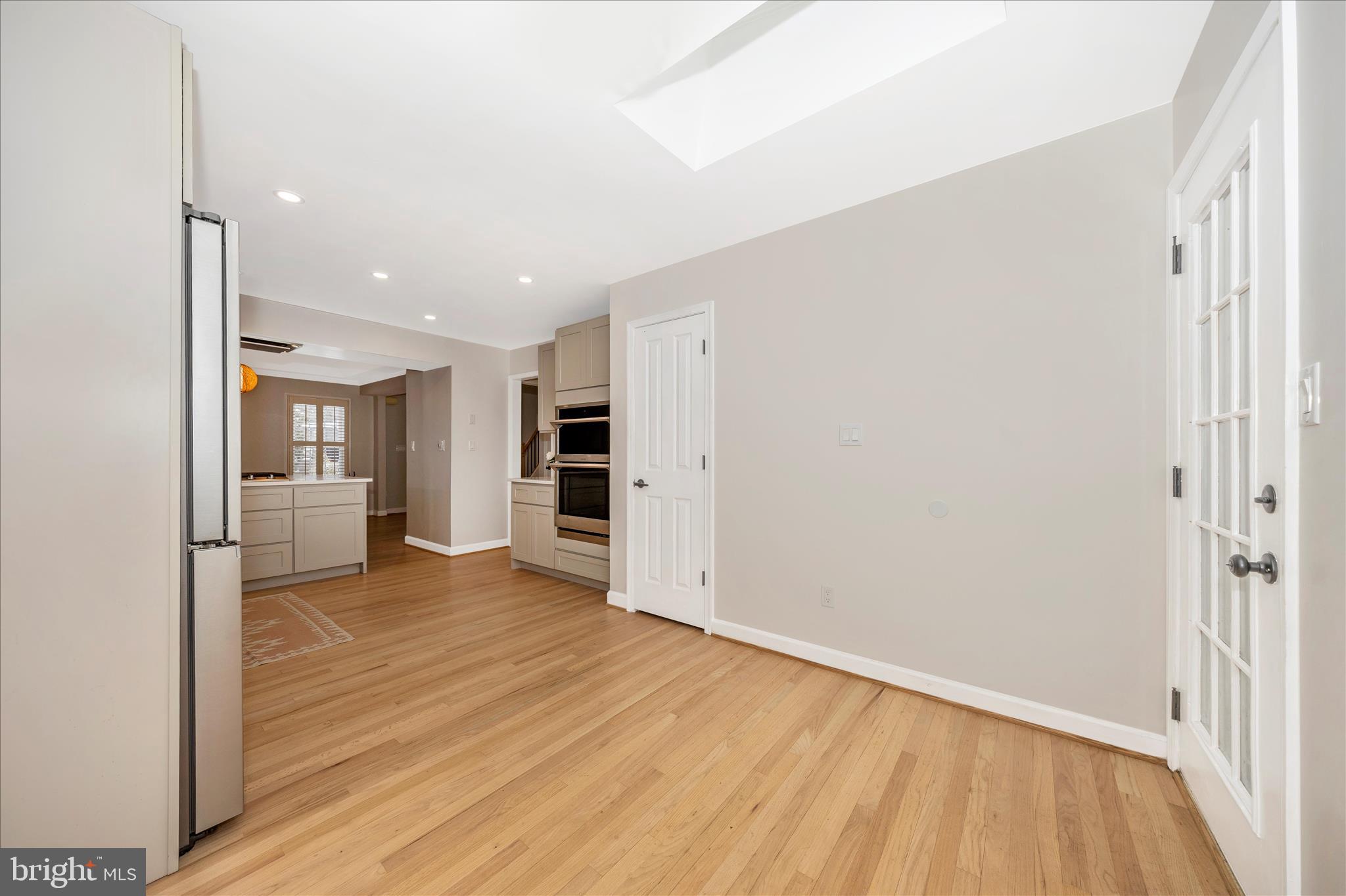 2478-5 Five Shillings Road Frederick, MD 21701 - Photo 22 of 77 a view of a big room with wooden floor and a kitchen