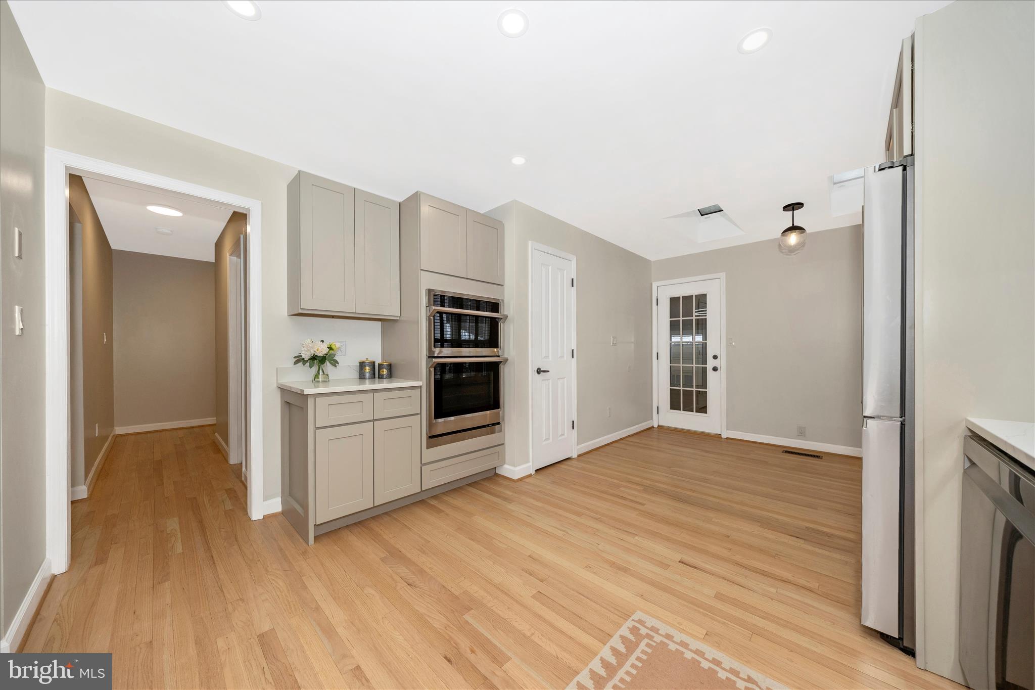 2478-5 Five Shillings Road Frederick, MD 21701 - Photo 23 of 77 a kitchen with granite countertop a refrigerator and a stove top oven
