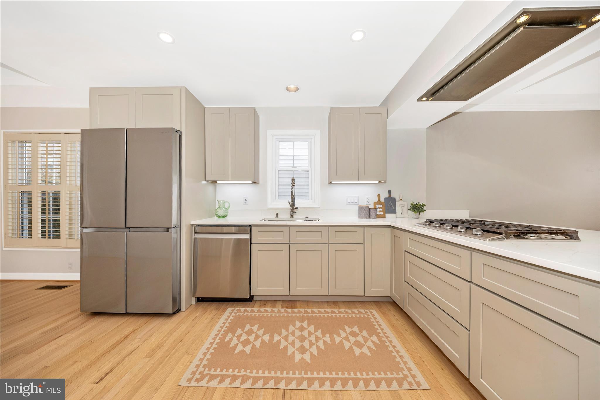 2478-5 Five Shillings Road Frederick, MD 21701 - Photo 26 of 77 a kitchen with a white cabinets and white appliances