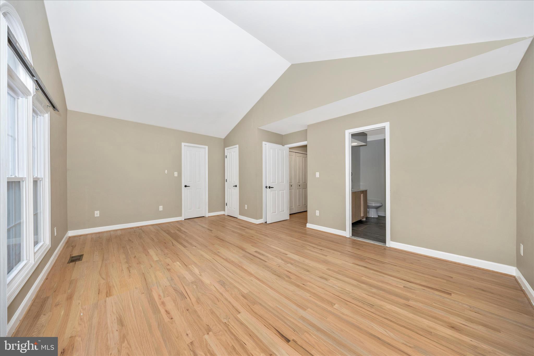 2478-5 Five Shillings Road Frederick, MD 21701 - Photo 29 of 77 a view of an empty room with wooden floor