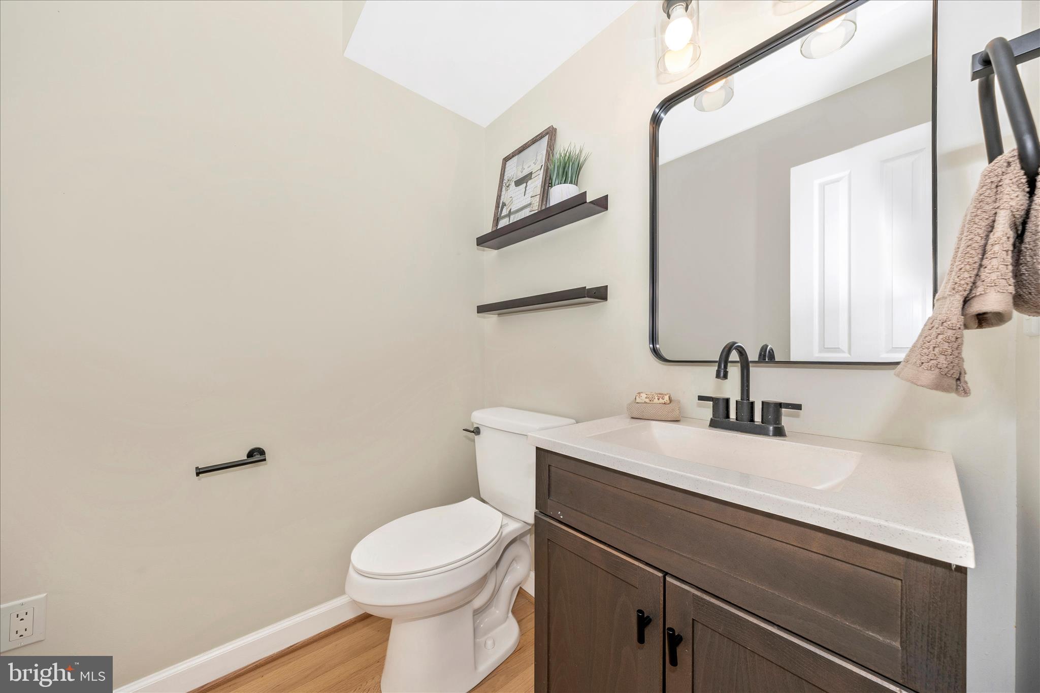 2478-5 Five Shillings Road Frederick, MD 21701 - Photo 37 of 77 a bathroom with a sink toilet and mirror