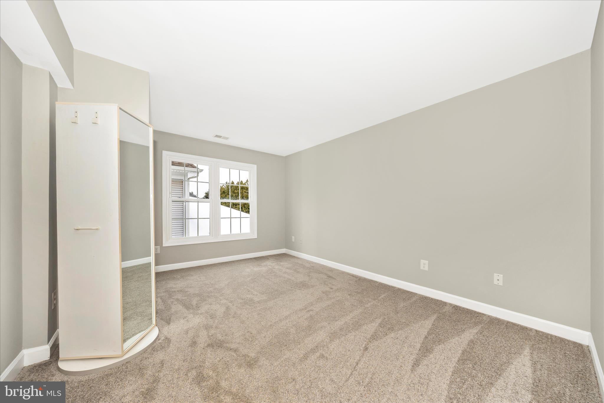 2478-5 Five Shillings Road Frederick, MD 21701 - Photo 42 of 77 an empty room with windows