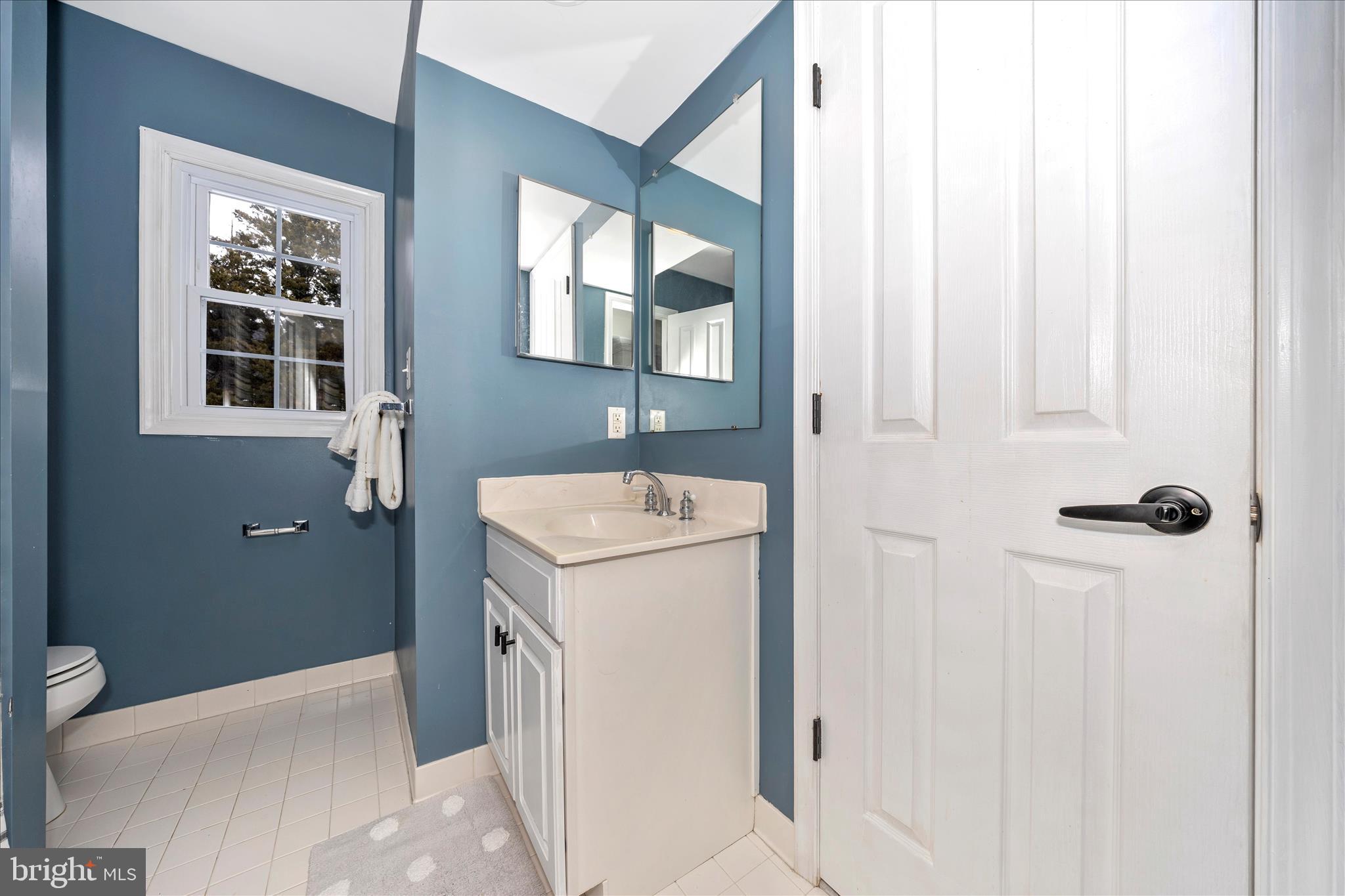 2478-5 Five Shillings Road Frederick, MD 21701 - Photo 44 of 77 a bathroom with a sink a toilet and shower