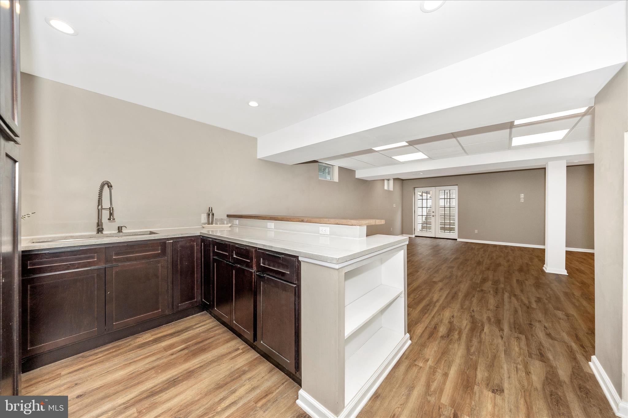 2478-5 Five Shillings Road Frederick, MD 21701 - Photo 46 of 77 a kitchen with a sink and wooden floor