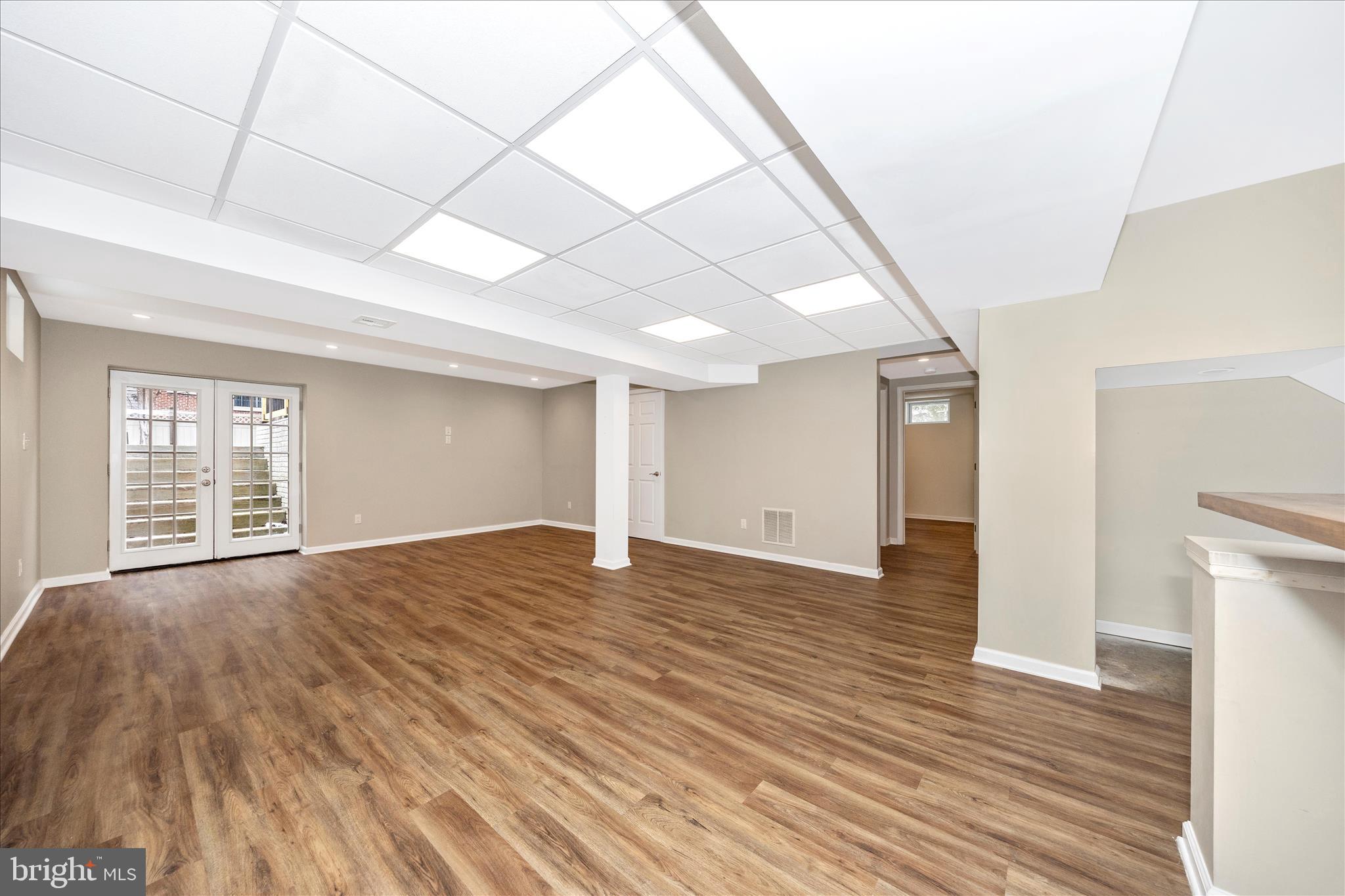 2478-5 Five Shillings Road Frederick, MD 21701 - Photo 50 of 77 a view of an empty room with wooden floor and a window