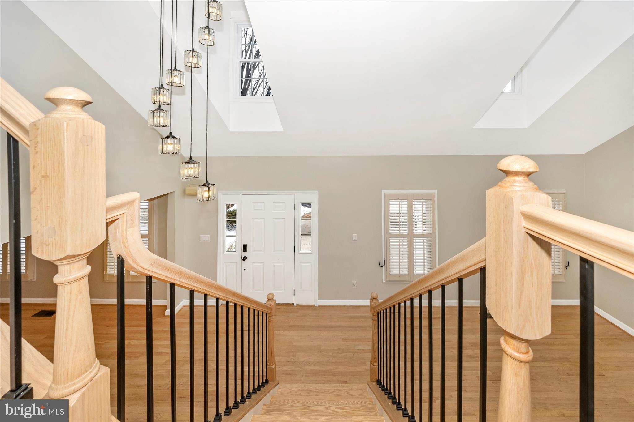2478-5 Five Shillings Road Frederick, MD 21701 - Photo 8 of 77 a view of staircase with lots of frames on wall and a window