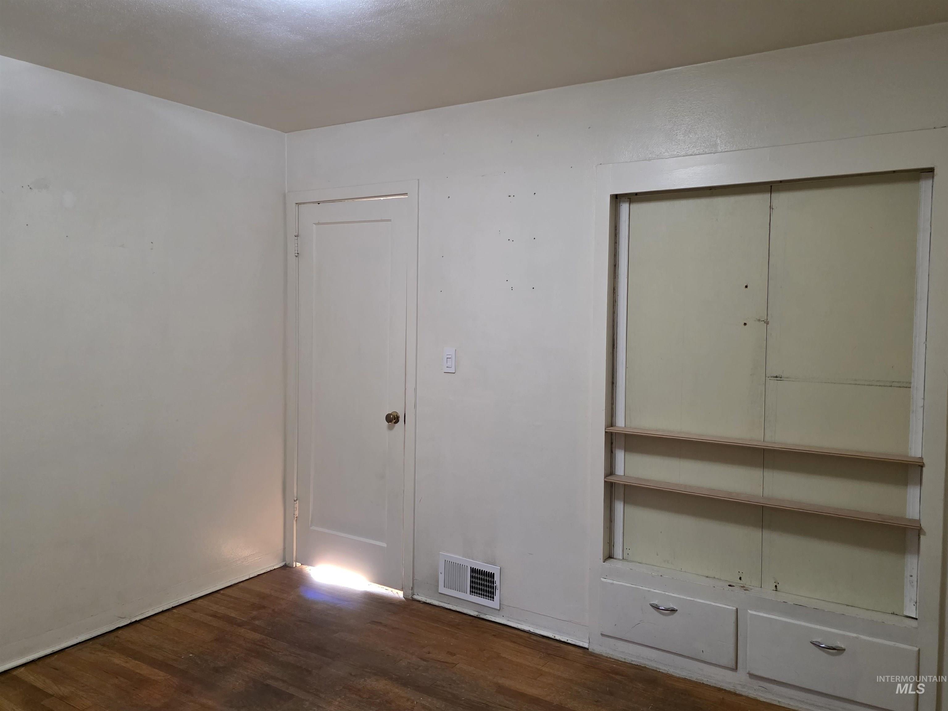 503 Oak Street Kamiah, ID 83536 - Photo 14 of 36 Unfurnished bedroom with dark wood-style floors