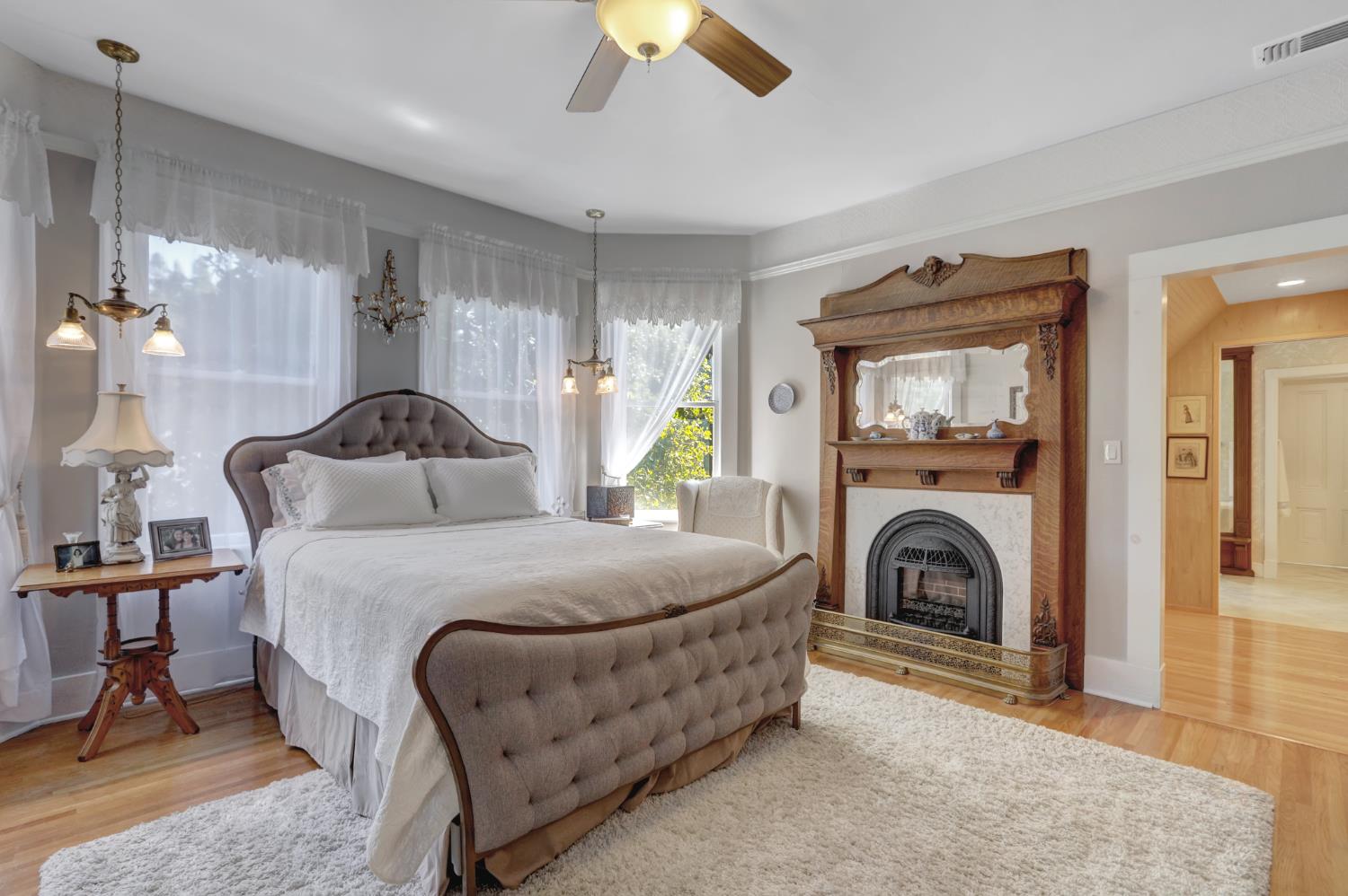 203 Prospect Street Nevada City, CA 95959 - Photo 31 of 95 Upstairs primary bedroom with hardwood floors, gas fireplace and lots of beautiful light