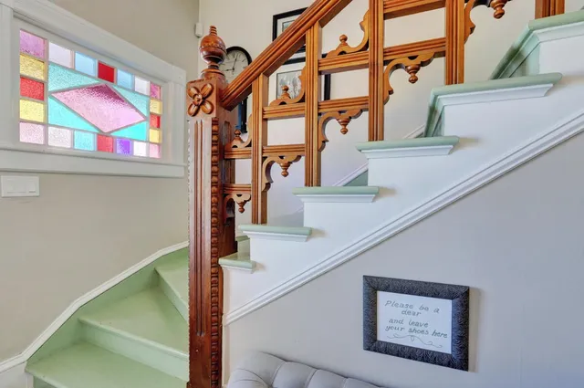 a view of backyard with table and chairs and wooden floor