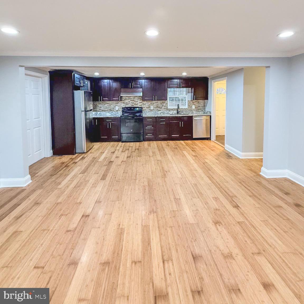 205 Biddle Road Accokeek, MD 20607 - Photo 16 of 31 a open kitchen with stainless steel appliances granite countertop a refrigerator and stove
