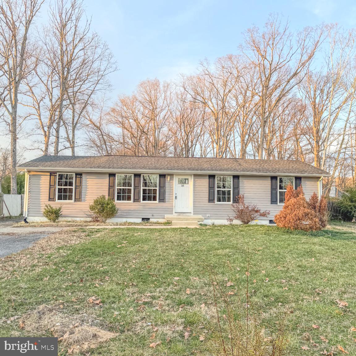 205 Biddle Road Accokeek, MD 20607 - Photo 2 of 31 a front view of a house with a yard and trees