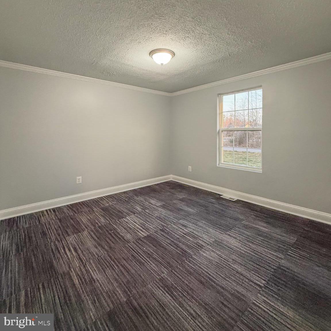 205 Biddle Road Accokeek, MD 20607 - Photo 24 of 31 an empty room with wooden floor and windows