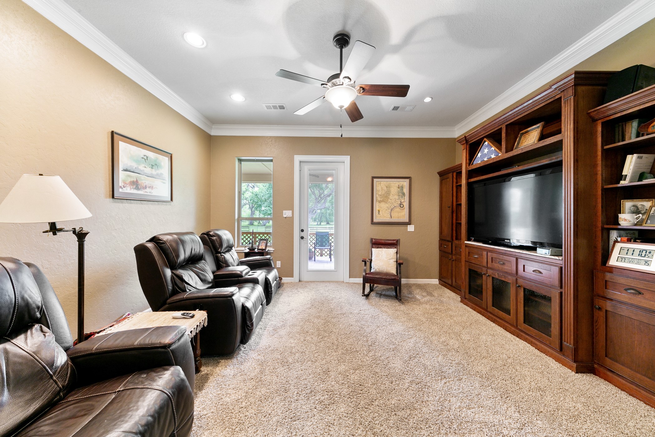 923 Y U Jones Road Richmond, TX 77469 - Photo 17 of 50 a living room with furniture and a flat screen tv