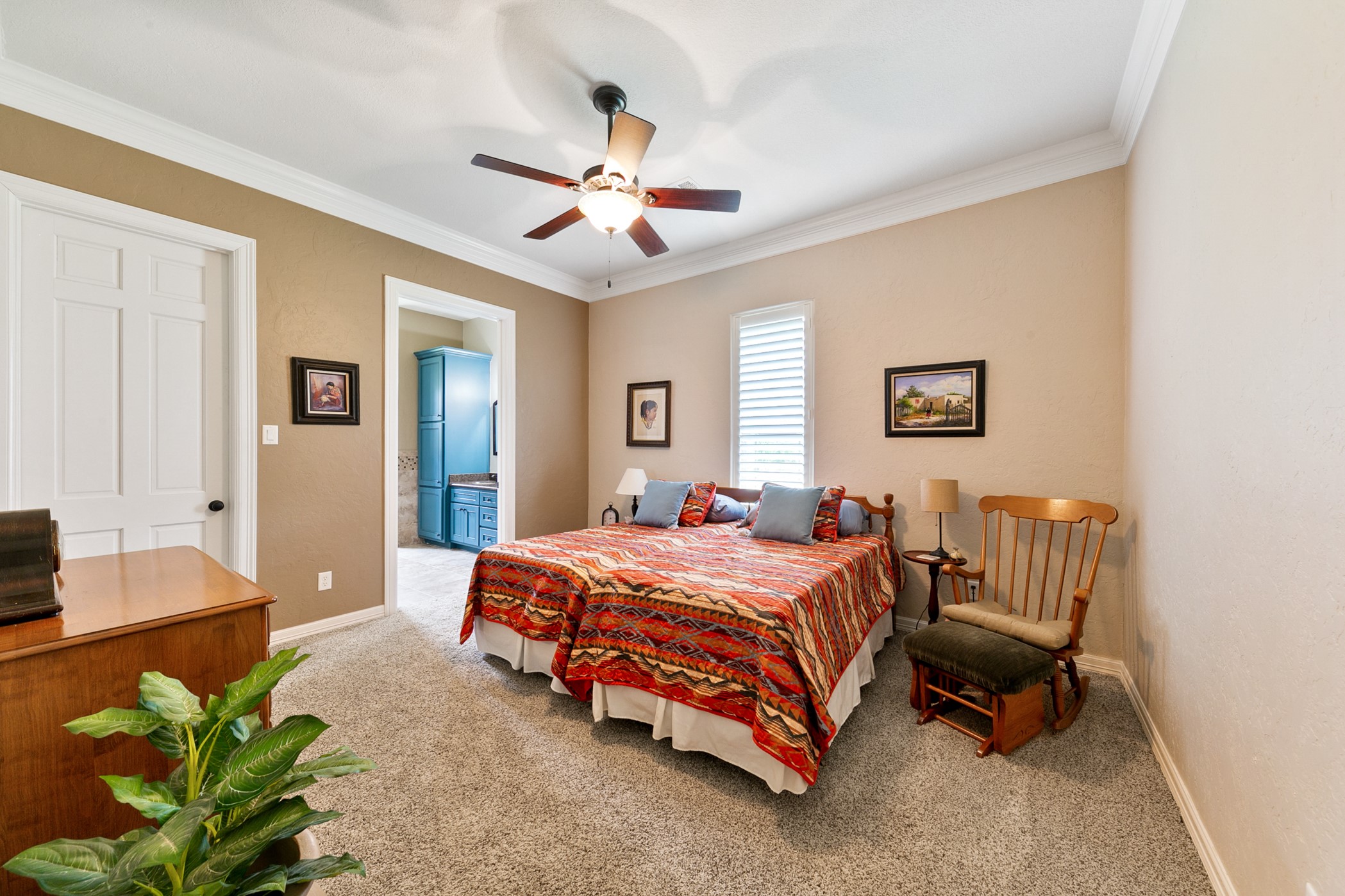 923 Y U Jones Road Richmond, TX 77469 - Photo 18 of 50 a bedroom with a bed and a chandelier