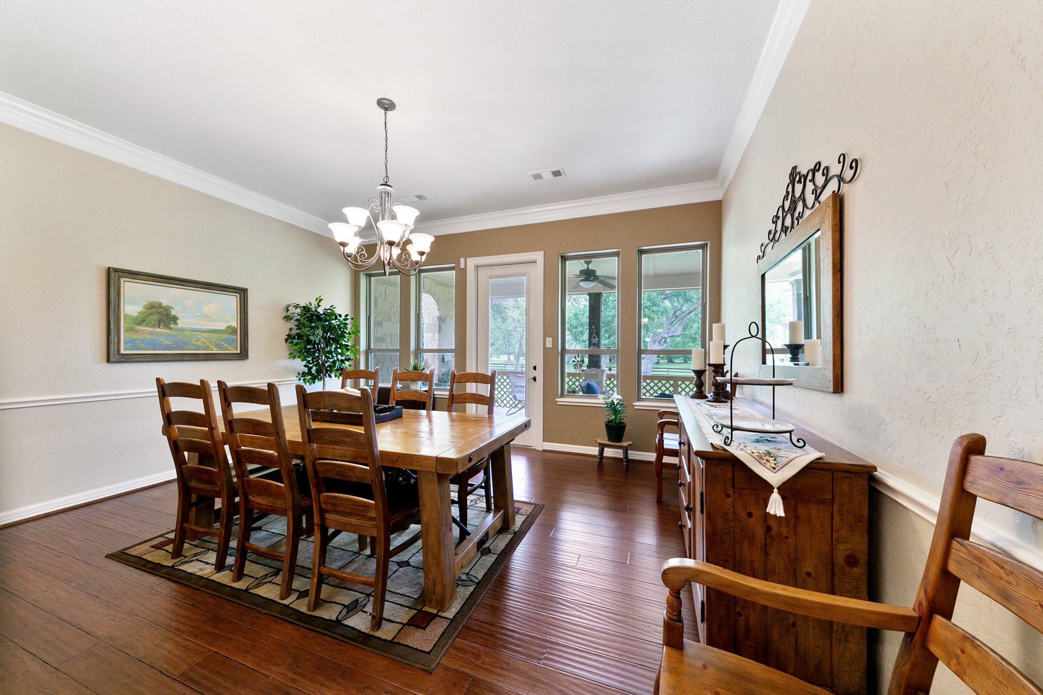 923 Y U Jones Road Richmond, TX 77469 - Photo 23 of 50 a view of a dining room with furniture a chandelier and wooden floor