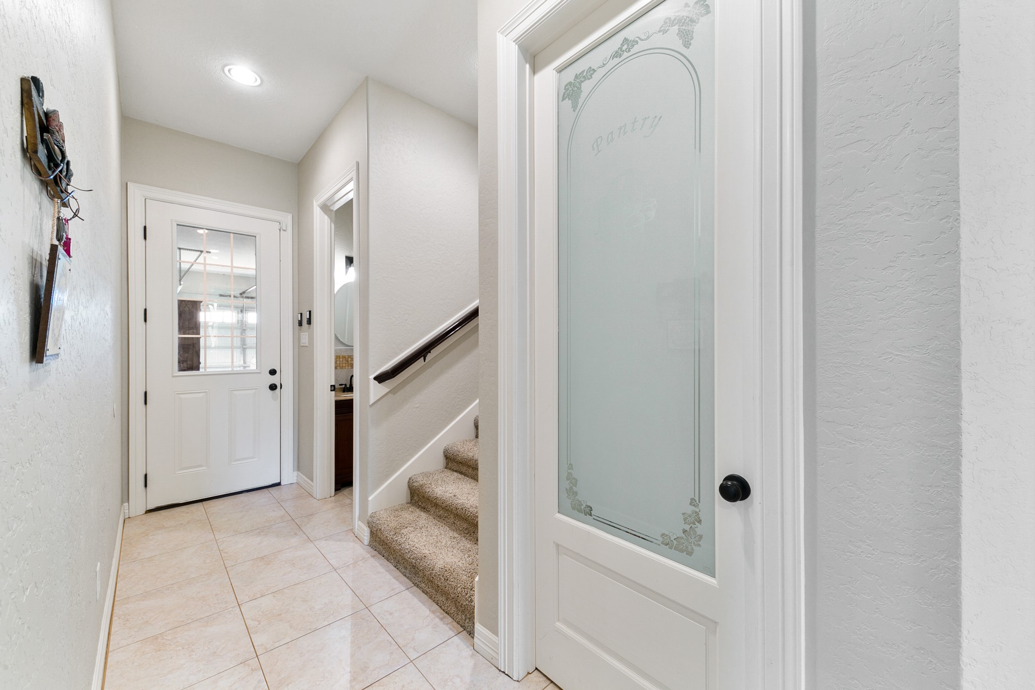 923 Y U Jones Road Richmond, TX 77469 - Photo 24 of 50 Garage entry to house with Peekaboo window conveniently leading to downstairs Half Bathroom, 2nd Floor, Pantry and Laundry/MUD room.