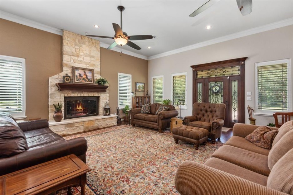 923 Y U Jones Road Richmond, TX 77469 - Photo 9 of 50 Family and friends can gather around the wood burning fireplace.