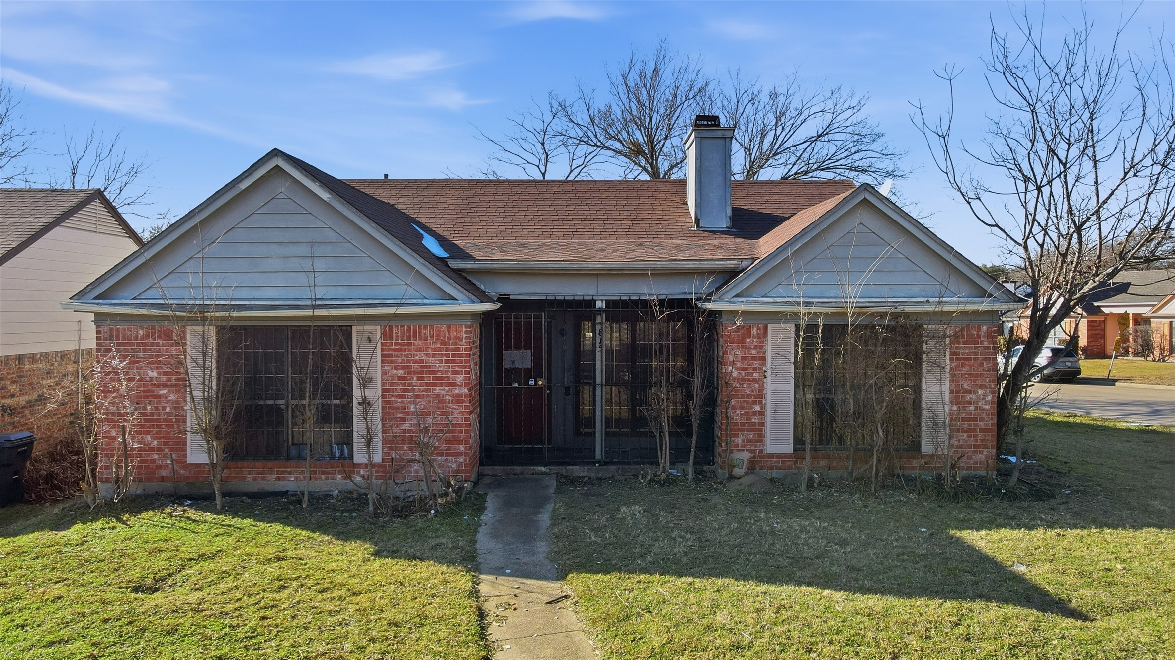 815 Apache Drive Dallas, TX 75217 - Photo 2 of 6 a front view of a house with garden