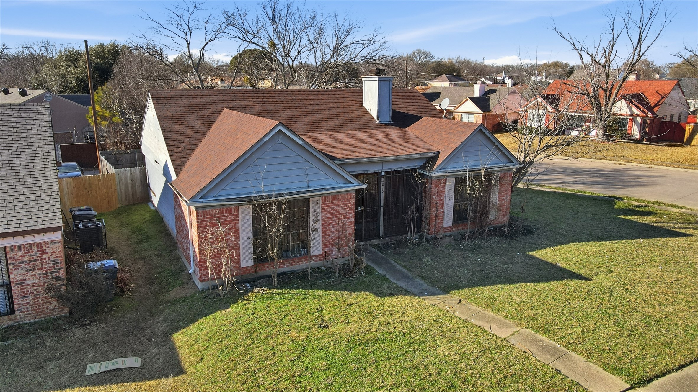 815 Apache Drive Dallas, TX 75217 - Photo 4 of 6 a front view of a house with a yard and garage