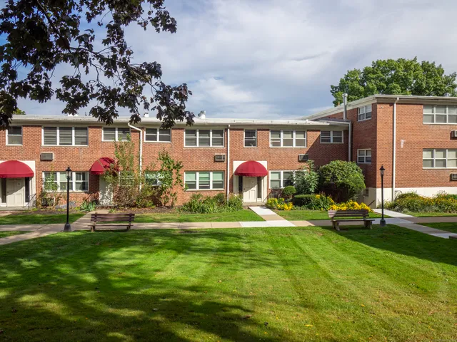 a front view of building with yard