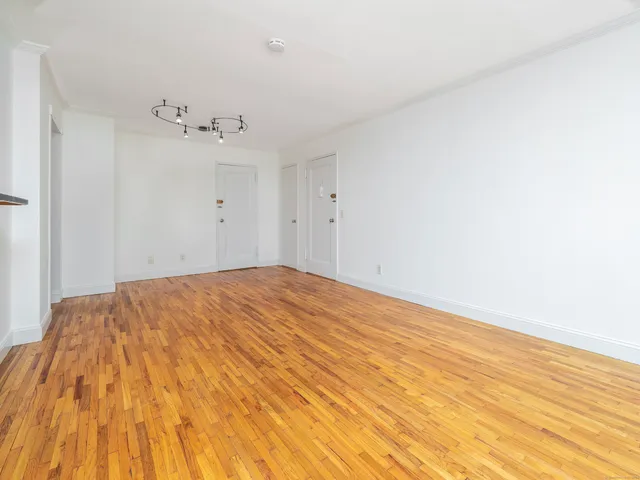 a view of a big room with wooden floor
